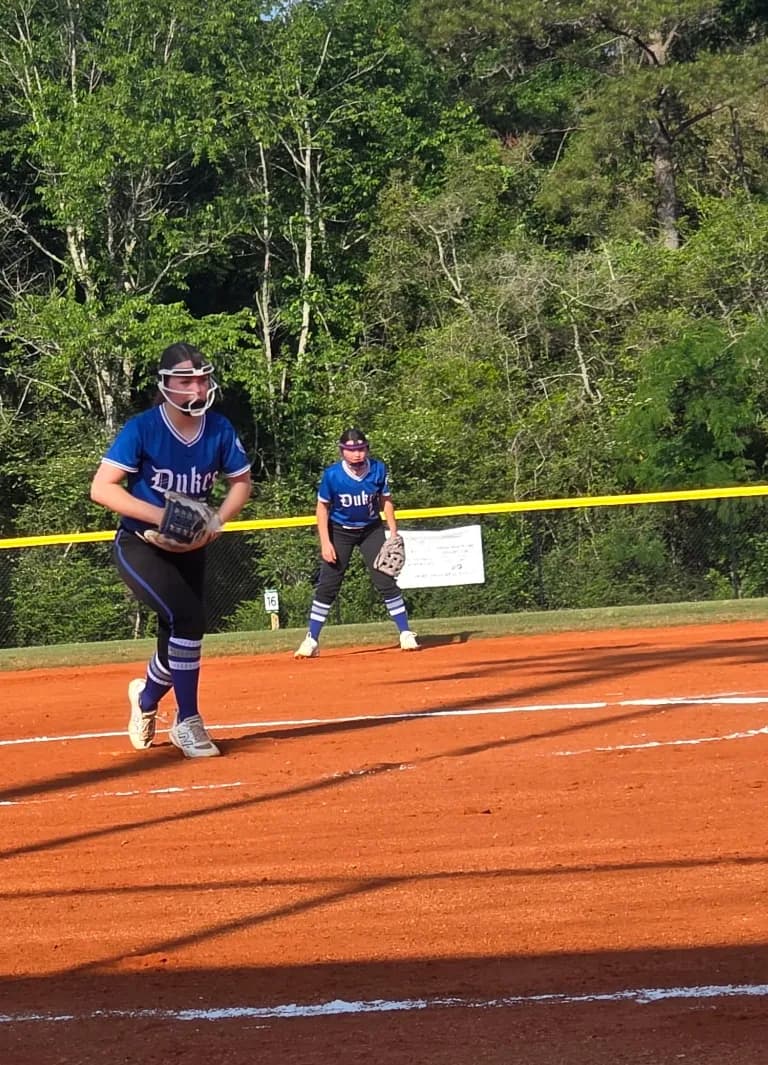 Alexis Arnold at the top of her windup for the Lady Dukes.